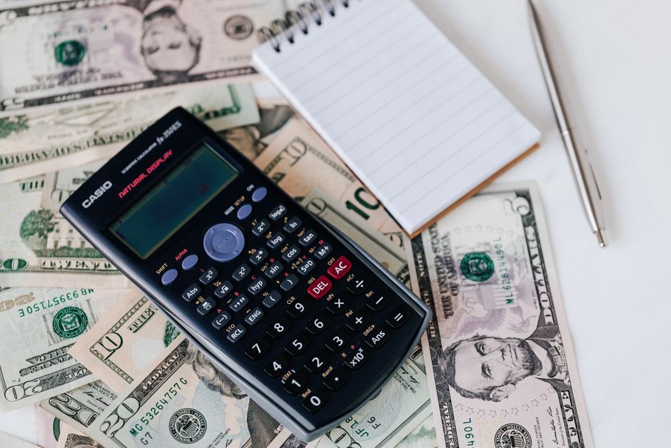 한국 금융시장 동향 — 2026년 9월 17일(목) — From above electronic calculator and notepad placed over United States dollar bills together with metallic pen for budget planning and calculation