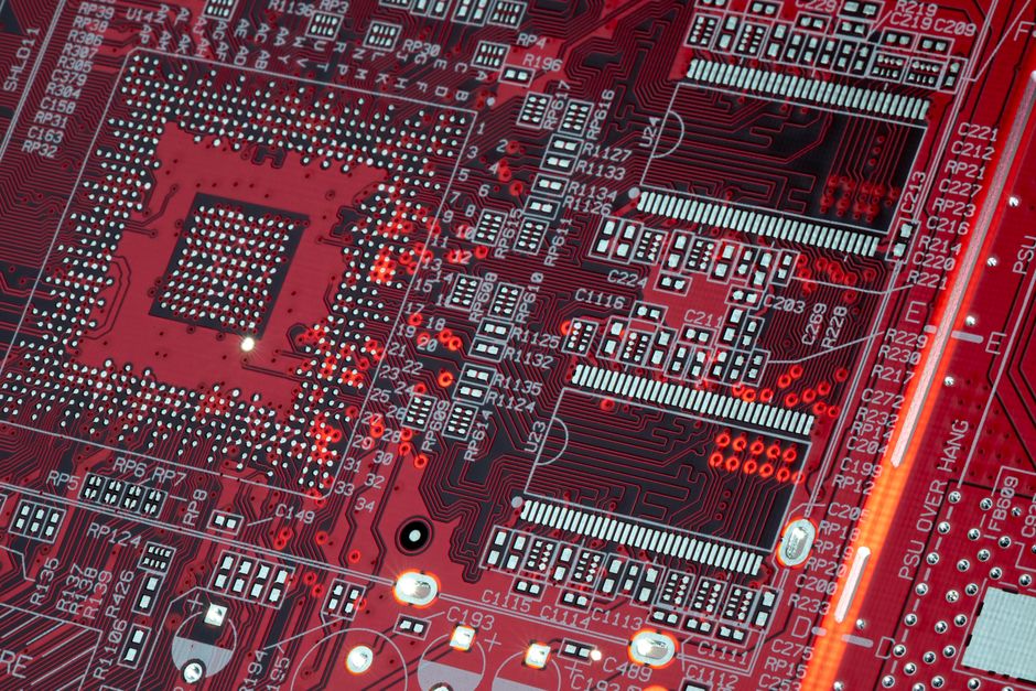 한국 금융시장 동향 — 2026년 10월 18일(일) — Detailed shot of a red motherboard showcasing electronic components and circuits.